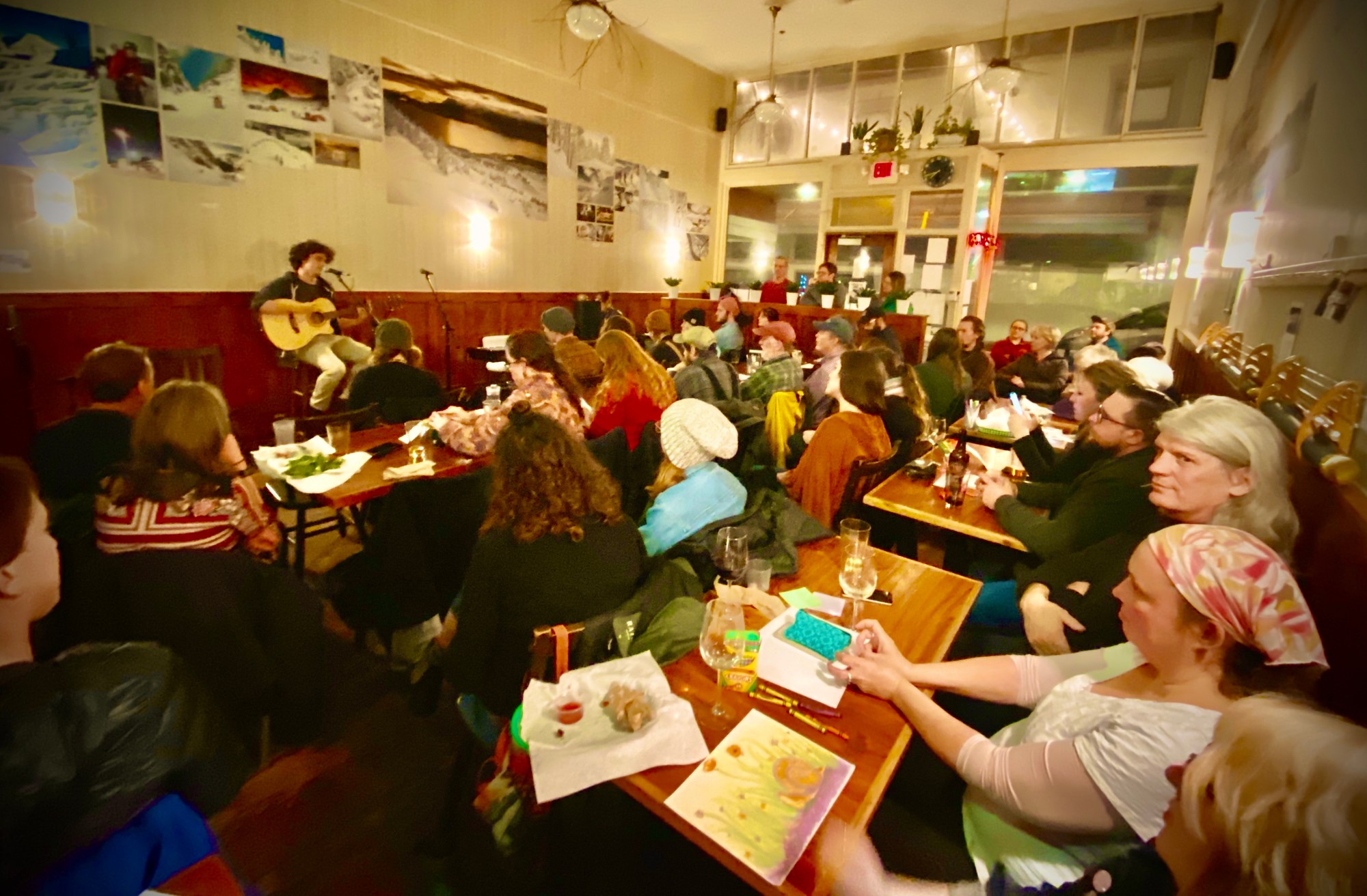 Photo-Nov-13-7-42-16-PM a group of people sitting at a table in a restaurant